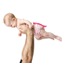 girl in Superman Pink Snap-in-One Cloth Diaper with Cape