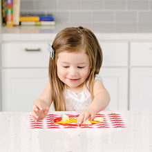 Girl eating on the Wonder Woman Silicone Placemat