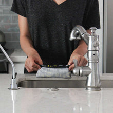 Rinsing snack bag in sink