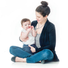 Mom with Baby chewing on silicone teething necklace