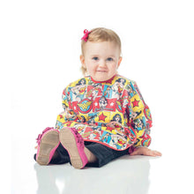 girl in Wonder Woman Sleeved Bib