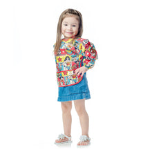 girl in Wonder Woman Sleeved Bib
