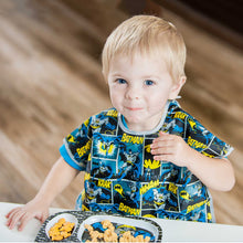 Boy at table in Batman Junior Bib with melamine plate
